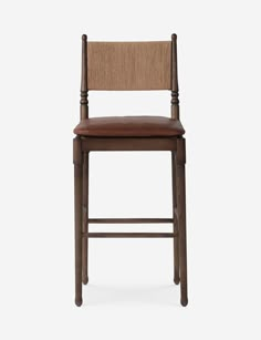 a wooden chair with a brown leather seat and backrest, against a white background