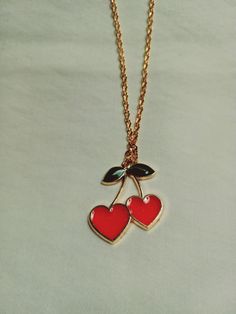 cherry fruit necklace; heart shaped red cherries;  perfect for spring Cute Heart Pendant Necklace, Cute Heart Pendant Necklace With Clavicle Chain, Cute Heart Shaped Necklace With Adjustable Chain, Trendy Red Heart Beads Necklace, Trendy Red Necklace With Heart Charm, Trendy Red Pendant Necklace, Trendy Red Pendant Charm Necklaces, Cute Heart-shaped Necklace With Adjustable Chain, Trendy Red Pendant Charm Necklace