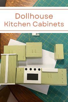 the dollhouse kitchen cabinets are green and white