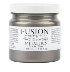 a silver metallic paint bottle with white cap on the top and bottom, that says fusion mineral paint