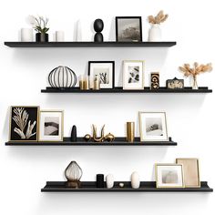 two black shelves filled with pictures and vases