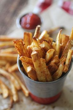 french fries in a small cup on a table