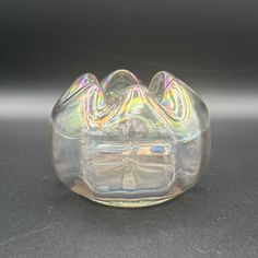 a clear glass vase sitting on top of a table