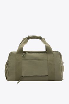 the large duffel bag in khaki green is shown from the front view