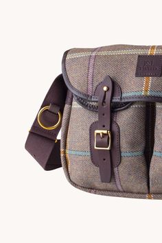 Our J&L Tweed angling products express the Scotsman’s quiet confidence as you arrive at your next country sports weekend. Made in classic Tweeds with sturdy leather trim and handy little pockets for keeping things safe. Measurements: L11.5″xH10″xD4″/L30cmxH25cmxD10cm Each Item purchased includes a photo taken personally by Liz in the Highlands Classic Tweed Bag For Everyday Use, Classic Tweed Bags For Everyday Use, Classic Tweed Bags For Everyday, Wool Travel Bags For Fall, Classic Saddle Bag With Leather Trim For Travel, Brown Tweed Travel Bag, Classic Shoulder Bag With Leather Trim For Outdoor, Classic Outdoor Satchel With Adjustable Strap, Classic Shoulder Bag With Leather Handles For Outdoor