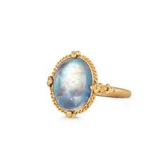 This oval Moonstone shimmers with iridescence, revealing faint orange streaks through a blue wash. This enchanting gem is set in a meticulously hand-crafted gold setting with braided gold and granulated prongs. One-of-a-kind.Ready to ship in size 7. Please allow 1-2 weeks for any other size. Technical Details Metal: 18k yellow goldMoonstone: 6.4 cts. Ring face: 16mm x 13mmBand width: 2mmHandmade in New YorkStyle # R-2709-MO Heirloom Yellow Gold Moonstone Ring, Oval Cabochon, Heirloom Yellow Gold Oval Cabochon Moonstone Ring, Heirloom Yellow Gold Moonstone Ring, Heirloom Gold Moonstone Ring Oval Cabochon, Heirloom Gold Moonstone Oval Cabochon Ring, Yellow Gold Oval Moonstone Ring With Gemstone Accents, Gold Oval Moonstone Ring With Gemstone Accents, Elegant Hand Forged Oval Moonstone Ring, Heirloom Oval Cabochon Moonstone Ring