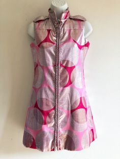 Very rare and special vintage late 60s/early 70s Ted Lapidus haute couture high-collared mini dress, in lovely shades of pink and silver in overlapping circular shapes, with front metal zipper from hem to neck edged in beading. Label TED LAPIDUS Size approx small, F38 Fabric unknown Made in France This is just the perfect little party dress, lovely colours, simple cut, easy to wear, but also very very cool and a little bit disco.  I can imagine someone like Goldie Hawn on the Rowan and Martin's Laugh-in wearing this! (google this if you are too young to remember Overall it is is very good condition considering its age, and that it must have partied quite a bit back in its day.  On the exterior there is one small piece of surface damage (around the left hip area, see last photo).  Inside th Festive Fitted Pink Mini Dress, Festive Pink Fitted Mini Dress, Pink Fitted Mod Dress, Fitted Pink Mod Dress, Festive Vintage Pink Dress, Late 60s Fashion, 1960s Mini Dress, Ted Lapidus, Silk Dress Vintage