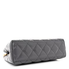 This is an authentic CHANEL Shiny Aged Calfskin Quilted Nano Kelly Shopper in Grey. This mini bag is a twist on an archival Chanel bag, featuring a long crossbody chain strap. This dual top handle bag is quilted in aged calfskin leather in grey, accented by aged gold hardware, including a Chanel CC turn-lock at the flap. This opens to a compact leather interior with zipper and flat pockets. Archival Chanel, Handle Bag, Leather Interior, Chain Strap, Chanel Bag, Gold Hardware, Mini Bag, Top Handle, Calf Skin