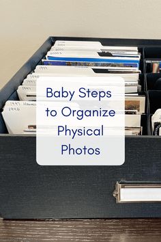 baby steps to organize physical photos in a black box with the title, baby steps to organize physical photos