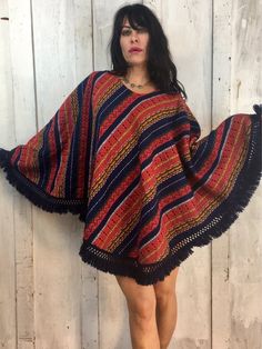 Love This Vintage Poncho!Vibrant Gorgeous Colors and PatternFolk ArtHandmadeHandwovenHand EmbroideredFeels like CottonExcellent Condition!One Size Fits Most!Length~30" Handwoven Poncho Shawl For Festivals, Handwoven Festival Poncho Shawl, Bohemian Handwoven Poncho For Festival, Bohemian Handwoven One-size Cape, Bohemian One-size Handwoven Cape, Red Bohemian Poncho For Festival, Bohemian Handmade Poncho Cape, Bohemian Handwoven Shawl Poncho, Hippie Shawl Poncho For Festivals