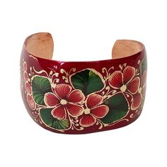 It's time to change your boring jewelry collection and add something trendy yet traditional to it! Mexican artists handcraft the bangle bracelet out of highly durable copper that lasts for a lifetime. The classic hand-painted pattern of flowers and leaves gives the bangle bracelet a super chic, modern look, while the red enameled plate keeps it classy and timeless. Lights up your look by adding this fabulous and on-trend style bracelet bangle to your wrist! This jewelry piece is a perfect fashio Red Bracelets For Festivals, Traditional Red Cuff Bracelet As Gift, Festival Red Bracelets, Red Hand Painted Jewelry For Festivals, Artistic Hand Painted Bracelets As Gift, Traditional Flower Shaped Bracelets, Traditional Copper Bracelet As Gift, Hand Painted Wearable Art Bracelet As Gift, Hand Painted Bangle Jewelry Gift