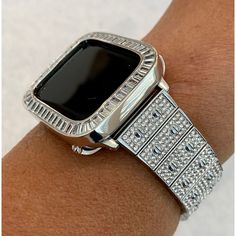 Fits Apple Watch in sizes 38mm 40mm 41mm 42mm 44mm 45mm Series 1-6 SE. This is a custom Iwatch Candy Apple Watch Band in Silver set with Swarovski Crystal in a luxury Alloy Metal. The sparkle on this band is amazing. Can be adjusted to fit wrist sizes from 5.5" to 8". Easy to resize and comes with a tool/instructions. You can select the set band+bezel, band only or bezel cover only using the drop down menus. Bezel Cover Add a Silver custom 14k white gold plated Metal Case Cover Bezel with hand s Bezel Band, Ceramic Watch, Candy Apple, Rose Gold Band, White Gold Band, Bezel Diamond, Apple Watch Band, Lab Diamonds, Silver Band