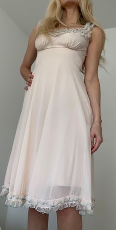 Beautiful condition pink/ivory negligee with ruffle trim at collar and bottom hem. Modeled on a 4/6, best fits a size M. Please note, this dress is sheer and is pictured on wearer with a slip.  Great for date night or even with a cute oversized blazer for a daytime look! Message me if you have any questions! Please note, when purchasing vintage please anticipate regular wear and tear on garments. Anything alarming with be noted in advance. Happy shopping! Negligee Dress, Bullet Bra, Sleepwear Fashion, Frilly Dresses, Old Fashion Dresses, Causal Outfits, Pink Ivory, Silk Slip Dress, Nightgowns