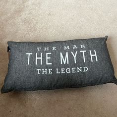 a pillow that says the man, the myth and the legend