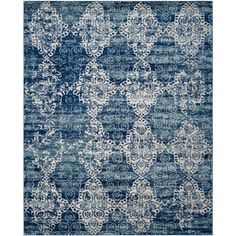 a blue and white rug with an intricate design