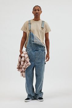 Baggy fit overalls by the essential BDG denim label. Classic bib front overalls with adjustable shoulder straps and utility pockets. Urban Outfitters exclusive. Features BDG Nitro baggy overall Workwear bib front overalls Adjustable shoulder straps Pouch front pocket Utility pockets UO exclusive Content + Care 100% Cotton Machine wash Imported Size + Fit Model in Charcoal is 6’2" and wearing size 32 Measurements taken from size 32 Length: 65" Rise: 13.5" Inseam: 29" Leg opening: 11" | BDG Nitro Utility Style Relaxed Fit Shortalls With Pockets, Utility Style Shortalls With Pockets And Relaxed Fit, Relaxed Fit Utility Shortalls With Pockets, Casual Bib Front Overalls For Streetwear, Fall Relaxed Fit Shortalls With Pockets, Utility Style Washed Denim Jumpsuit With Relaxed Fit, Utility Overalls With Side Pockets For Streetwear, Utility Denim Overalls, Utility Overalls With Cargo Pockets And Relaxed Fit