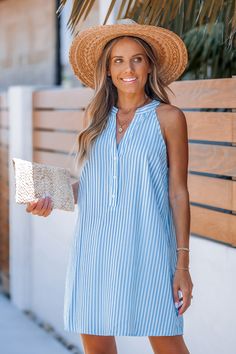 Looking for a fresh summer look? The Blue Striped Sleeveless Mini Dress offers a vibrant stripe pattern and a cool, breezy fit. Perfect for keeping things casual and stylish on warm days. Product code: CAA05B4H023TC Features:  Woven Split round neckline Sleeveless Partial front buttons Mini Pattern: Stripes Material: 50%POLYESTER,50%COTTON. Striped V-neck Summer Sundress, Beach Dresses With Vertical Stripes, Casual Striped V-neck Sleeveless Dress, Striped Dresses For Summer Vacation, Casual Vacation Dress With Vertical Stripes, Chic Striped Sundress For Summer, Striped Sleeveless Vacation Dresses, Blue Sleeveless Sundress For Summer Outings, Summer Beach Dresses With Vertical Stripes