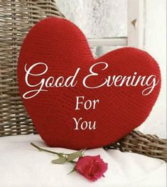 a red heart with the words good evening for you written on it next to a rose