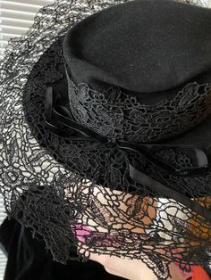 1930's/40's black dramatic hat with a HUGE brim made of stiff lace. Tag by Millenary Hilpatricks Elegant Short Brim Costume Hat, Vintage Fedora Costume Hats For Party, Vintage Wide Brim Top Hat For Costume, Vintage Fedora Hat For Evening, Elegant Curved Brim Hat For Costumes, Vintage Wide Brim Top Hat For Evening, Vintage Fedora For Evening Wear, Black Gatsby Style Hats For Evening, Vintage Wide Brim Top Hat For Party