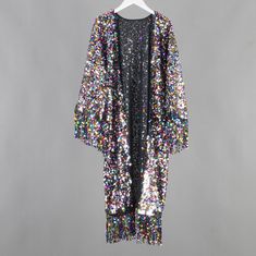 Welcome to my shop, I am in China. It will need around 30 days for international orders. Please consider the time when placing order. Sequin bohemian kimono,perfect for a casual day out. Material: mesh,sequins,chiffon This kimono have light,comfortable chiffon lining. Size: cuff opening to cuff opening: 47.2 inches (120cm),don't include tassels cuff width: 10 inches (25cm) chest: 27.5 inches( 70cm) flat length: 43 inches (110cm) include tassels Care: Wash in cold water Hand washing recommended Black Summer Party Kimono, Bohemian Spring Party Kimono, Spring Party Multicolor Kimono, Multicolor Long Sleeve Kimono For Party, Multicolor Long Sleeve Party Kimono, Long Multicolor Party Kimono, Multicolor Summer Party Kimono, Black Fall Party Kimono, Summer Party Multicolor Kimono