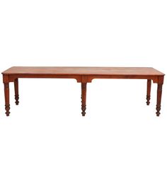 a large wooden table with two legs and a long, narrow top on an isolated white background