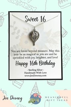 a birthday card with a heart shaped pendant on it