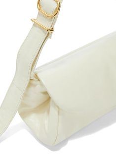 Cannolo Grande leather bag from JIL SANDER featuring off-white, calf leather, smooth grain, silver-tone hardware, foldover top with magnetic fastening, gold-tone hardware, adjustable shoulder strap and main compartment. Size Info UNI Color Detail White Made In Italy Material Lining: 100% Lambskin Exterior: 100% calf leather Season One Fall-Winter Season Two Fall-Winter Product bags.. Brand JIL SANDER FAshION Size And Fit Width 13,78 in / 35 cm Height 5,12 in / 13 cm Depth 5,12 in / 13 cm Strap 4 White Leather Shoulder Bag With Fold Over Clasp, Modern Leather Satchel With Fold Over Clasp, White Leather Baguette Bag With Top Handle, White Leather Top Handle Baguette Bag, White Leather Baguette Bag For Travel, White Leather Baguette Bag, White Rectangular Shoulder Bag With Fold Over Clasp, White Shoulder Bag With Fold Over Clasp For Evening, White Leather Flap Bag For Formal Occasions