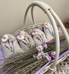 four lavender sacs are sitting in a wicker basket