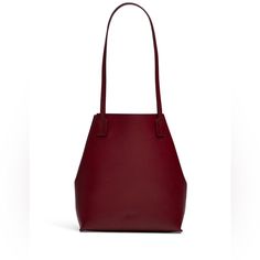 Dark Red Leather Small Soft Tote With Rolled Top Handles. Open Top And Interior Along With Zipper Pouch. 12"H X 10"W X 3.5"D. A Sleek And Minimal Silhouette Defines The Everday Ease Of This Jil Sander Navy Tote. Barely Used Good Condition Originally Retails For $450 Poow Classic Red Leather Bucket Bag, Red Top Handle Bucket Bag For Evening, Modern Red Bucket Bag, Red Evening Bucket Bag With Top Handle, Red Bucket Shoulder Bag For Evening, Elegant Burgundy Leather Bucket Bag, Elegant Red Bucket Bag For Formal Occasions, Modern Red Tote Bucket Bag, Modern Red Bucket Bag For Evening