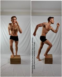 a man standing on top of a wooden block