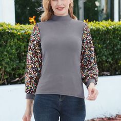 Elevate your style with the Anna-Kaci Women's Sequin Puffed Long Sleeve Mock Neck Pullover, a fashionable and elegant top adorned with glittering sequins. Perfect for parties, holidays, dates, Christmas, concerts, and any special event, this pullover adds a touch of glamour to any outfit. Fitted Balloon Sleeve Winter Tops, Fitted Balloon Sleeve Tops For Winter, Long Sleeve Tops With Contrast Sequin For Night Out, Contrast Sequin Long Sleeve Tops For Night Out, Trendy Balloon Sleeve Party Tops, Winter Sequins Blouse, Winter Tops With Contrast Sequin, Winter Contrast Sequin Tops, Fall Stretch Balloon Sleeve Tops