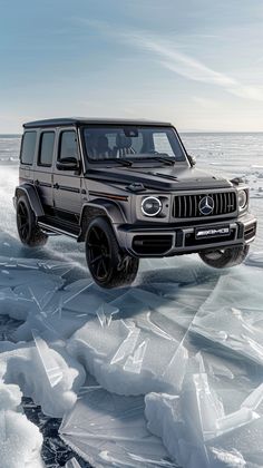 the mercedes benz g - class is driving on ice