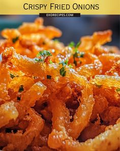 crispy fried onions on a plate with parsley in the middle and text overlay