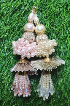 Indian Handmade Latkan Tassels for Saree Blouse Lehenga HandBags Hangings Dupatta Decoration Bridal Wedding dress for Women pair of 2 pcs Size - 11.00 cm Length  Item Description You can use this Beautiful pair of tassle for several DIY projects.  *These beautiful Tassel Latkans are used as the accessory for saree blouse on the back, but u can use according to your need and your innovative ideas. * Package contains 2 Latkan / 1 Pair Other Than Saree Blouse, you can use these latkans in various ways Craft Projects Designing Home Decoration Festive celebrations. Evening and party Apparels. Home décor items Apparel & Fashion Scarves n Stoles Headband, hats Table cover, curtains, Pillow covers, Cushion cover Shoe designing Headband, hats Table cover, curtains Designing stylish blouses Ship Fro Latkan For Lehenga Handmade, Tassels For Saree, Latkan Tassels, Wedding Dress For Women, Blouse Lehenga, Diy Floral Decor, Stylish Blouses, Happy Ganesh Chaturthi Images, Rakhi Design