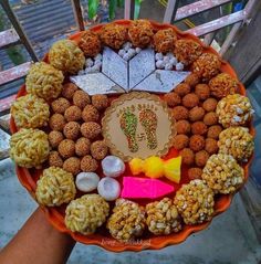 an orange plate filled with lots of different types of food