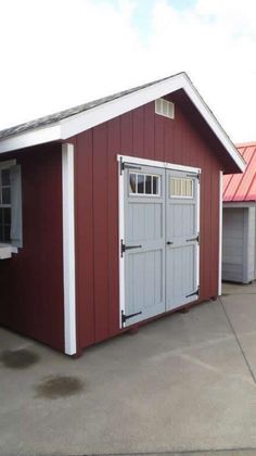 two garages side by side with one door open