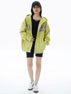 Make a bold statement with our Lime Green Graphic Zip Hoodie. This eye-catching sweatshirt features a vibrant lime green base with contrasting purple text across the chest. The playful typography design includes quirky eye graphics, adding a unique touch. With a comfortable fit, full-zip front, and kangaroo pockets, this hoodie combines style and practicality. Perfect for those who love standout streetwear with a fun twist, it's ideal for casual outings or lounging in style. The hoodie's bright Casual Green Hoodie With Logo Print, Purple Letter Print Sweatshirt For Streetwear, Oversized Green Hoodie For Streetwear, Green Hooded Sweatshirt With Logo Print, Green Logo Print Sweatshirt For Spring, Green Cotton Hip Hop Hoodie, Green Hooded Sweatshirt For Streetwear, Green Cotton Hoodie For Streetwear, Green Hip Hop Hoodie With Crew Neck