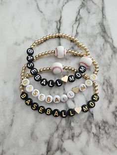 (1) This bracelet is perfect for any baseball mom or family member who wants to show off their spirit 14k round gold beaded bracelet with letter beads, heart and floating baseball make it a set with players name and number or other stacking bracelets  (balls may vary in color) Bracelet With Letter Beads, Baseball Mom Bracelet, Bracelet Game, Gift Ball, Baseball Accessories, Baseball Bracelet, Charm Bar, Baseball Mom Gifts, Mama Bracelet