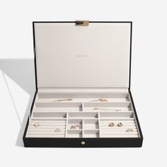 an open box containing several pairs of jewelry