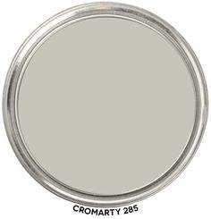 a round metal tray with the words cromarty 208 in white on it