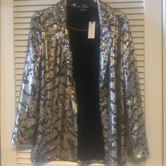 Anthropologie Sequin Jacket Blazer Retro S This Is Great Looking & Brightens Up Jean Or Pants Outfits Great Fir Going Out Night Or Day! Party Blazer Retro Look 90s By Maeve Roomy Runs A Little Big Length: 29” Pit To Pit: 19” Chic Metallic Blazer For Evening, Chic Metallic Evening Blazer, Elegant Metallic Blazer For Night Out, Elegant Metallic Long Sleeve Blazer, Metallic Long Sleeve Blazer For Work, Elegant Metallic Outerwear For Work, Chic Metallic Outerwear For Formal Occasions, Elegant Long Sleeve Outerwear For Party Season, Glamorous Metallic Outerwear For Party