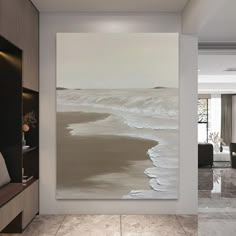 a large painting hanging on the wall in a living room