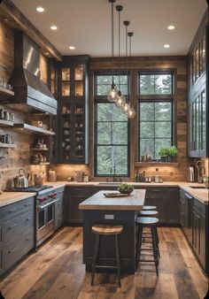 a kitchen with wooden floors and lots of counter space next to a window that has lights hanging from the ceiling