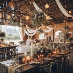 a rustic wedding reception with candles and flowers on the tables in front of an open air pavilion