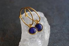 One cannot have enough of these earrings at all and with so many beautiful colors the decision is also difficult...A pair of these earrings as a birthday present or as a present for an invitation is a nice idea. There are so many possibilities and opportunities. These tiny hoop earrings are made of dyed sapphire stones set in 22 k gold-plated sterling silver. The gemstone pendants have a cut on both sides.The birthstones are: January: GarnetFebruary: AmethystMarch: Aqua QuartzApril: Crystal Quar Earrings Sapphire, Sapphire Stones, Gemstone Earrings Gold, Tiny Hoop Earrings, September Birthday, Gemstone Pendants, Sapphire Stone, Silver Gifts, Fun Earrings