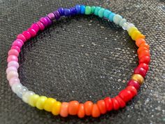 Stunning graduated rainbow multi coloured seed bead bracelet handmade with ❤️and lots of positive vibes by me. The bracelet is made with 4 mm glass beads on strong clear beading elastic.  The bracelet shown measures 19 cm. Should you be blessed with larger or smaller wrists please just leave me a message with your order indicating the size required & I shall happily make you a custom fit. Supplied tissue wrapped in a free gift bag. Healing Multicolor Hand-strung Friendship Bracelets, Multicolor Spiritual Bracelets With Tiny Beads, Spiritual Multicolor Bracelets With Tiny Beads, Rainbow Bracelets With Letter Beads For Festivals, Rainbow Round Beaded Bracelets For Friendship, Adjustable Rainbow Heishi Beads Bracelets, Rainbow Round Bead Friendship Bracelets, Adjustable Rainbow Heishi Beads Bracelet, Adjustable Rainbow Beaded Bracelets With Spacer Beads