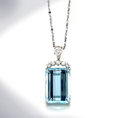 This necklace is a stunning find. The star of the piece is an emerald-cut sea-colored aquamarine that is 18 x 12 x 9mm and eye-clean. The aqua is set in a four-prong basket setting and has 5, SI1-SI3 accent diamonds that weigh approximately 0.15ctw set above it. The bail features a 0.30ct round brilliant cut SI1 diamond. The pendant is suspended from a sparkling 18K diamond-cut serpentine rope chain that is 16" long and 1.4mm thick. Secured with a spring ring clasp, the chain comes with the purc Diamond Star Necklace, Unique Rings Vintage, Geometric Hoop Earrings, Basket Setting, Diamond Star, Large Hoop Earrings, Shiny Things, Sterling Silver Hoops, March Birth Stone