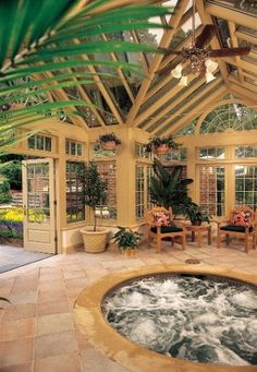 an indoor hot tub in the middle of a patio