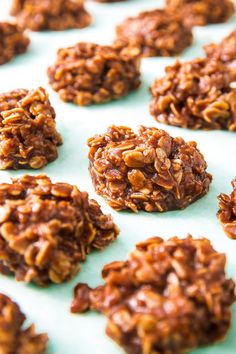 several cookies are arranged in rows on a blue surface with the words, no bake cookies