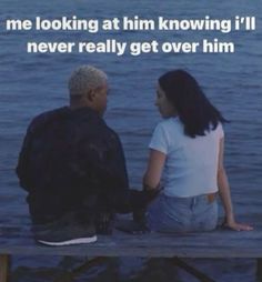 an older man and woman sitting on a dock looking at each other with the caption saying, me looking at him known i'll never really get over him